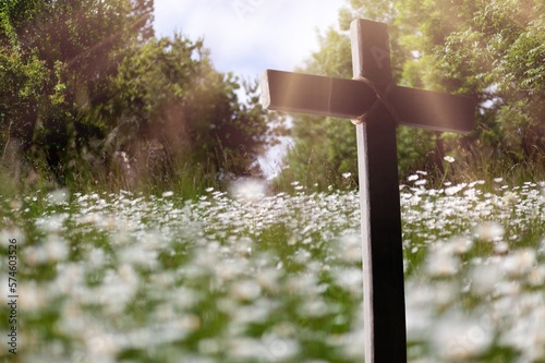 Wooden Cross in fresh spring flowers