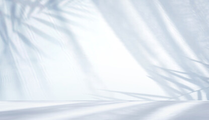 Minimal abstract light blue background for product presentation. Shadow of tropical leaves and curtains window on plaster wall.
