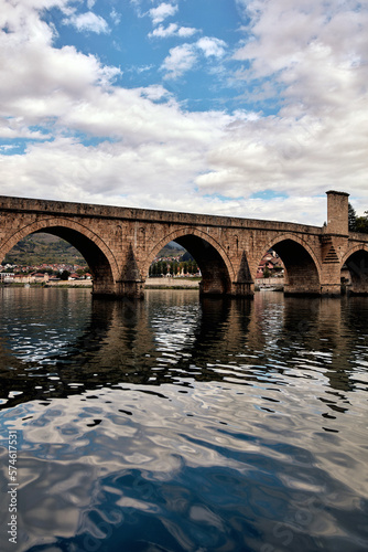 Bridge on river Drina, famous historic Ottoman architecture in Visegrad, Bosnia and Herzegovina. © astrosystem