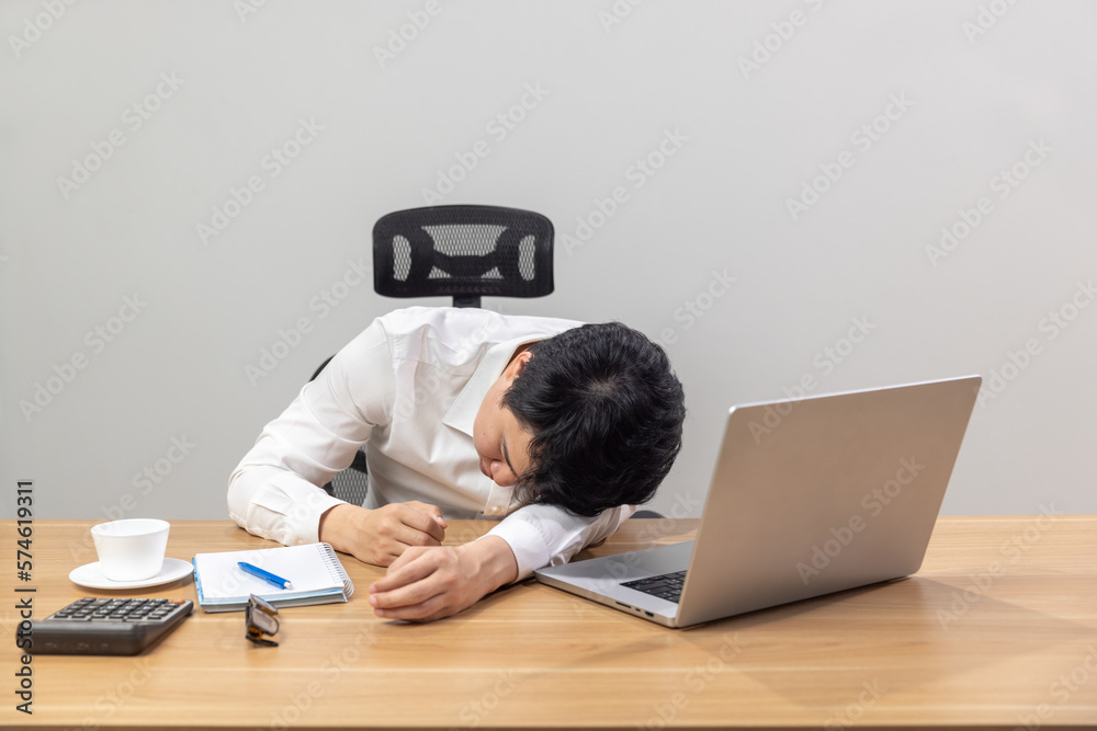 Man with narcolepsy is fall asleep on office desk..Narcolepsy is a sleep disorder that makes people very drowsy during the day. Man with narcolepsy is fall asleep on office desk..Narcolepsy is a sleep disorder that makes people very drowsy during the day.