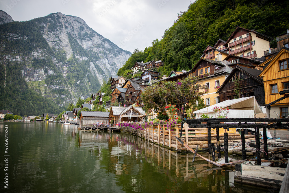 Mountain village in the Alps directly on the lake with clouds