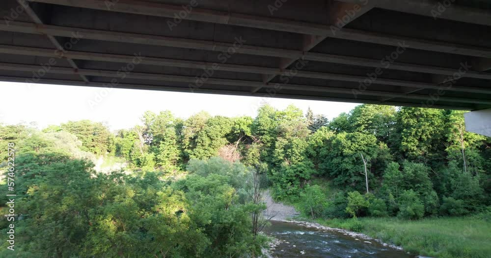 Flying under bridge panning up Flying under bridge panning up