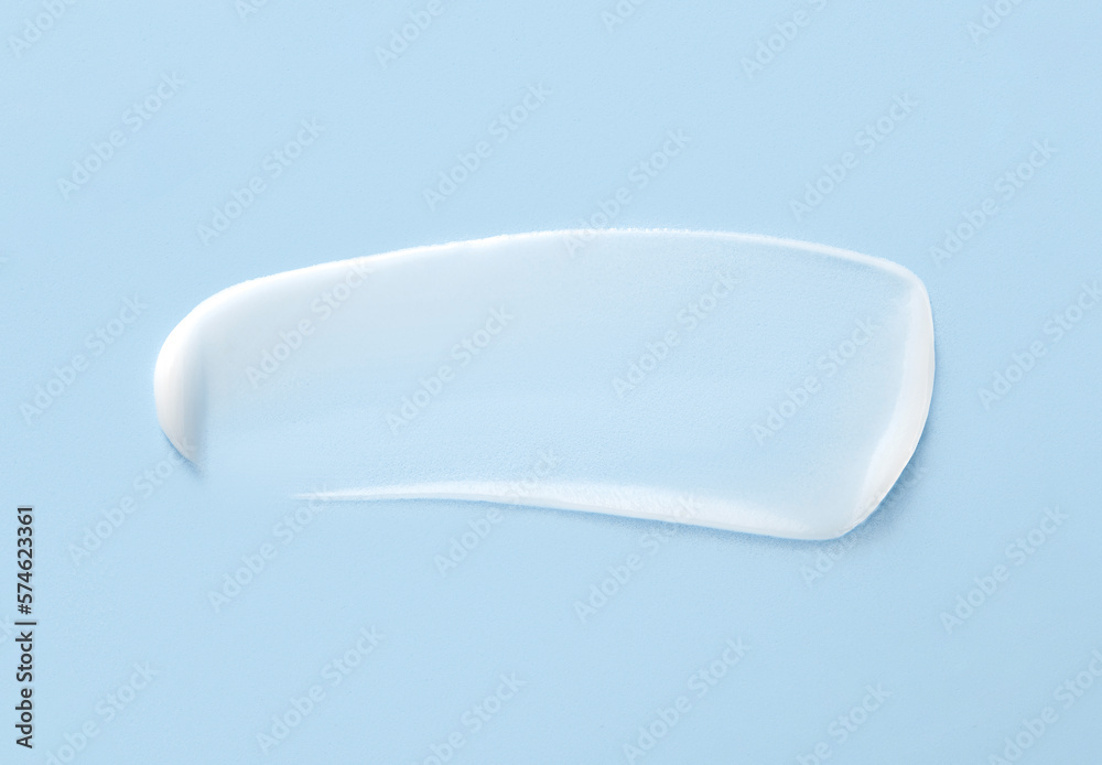 cosmetic smears cream texture on pastel blue background cosmetic smears cream texture on pastel blue background