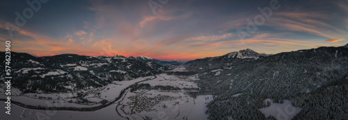 Sunset panoramic view of the top of Waidegg near Tressdorf on the border between Italy and Austria. Nassfeld ski resort in 5km. January 2022, drone aerial shot. photo