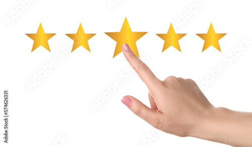 Quality evaluation. Woman touching virtual golden stars on white background, closeup