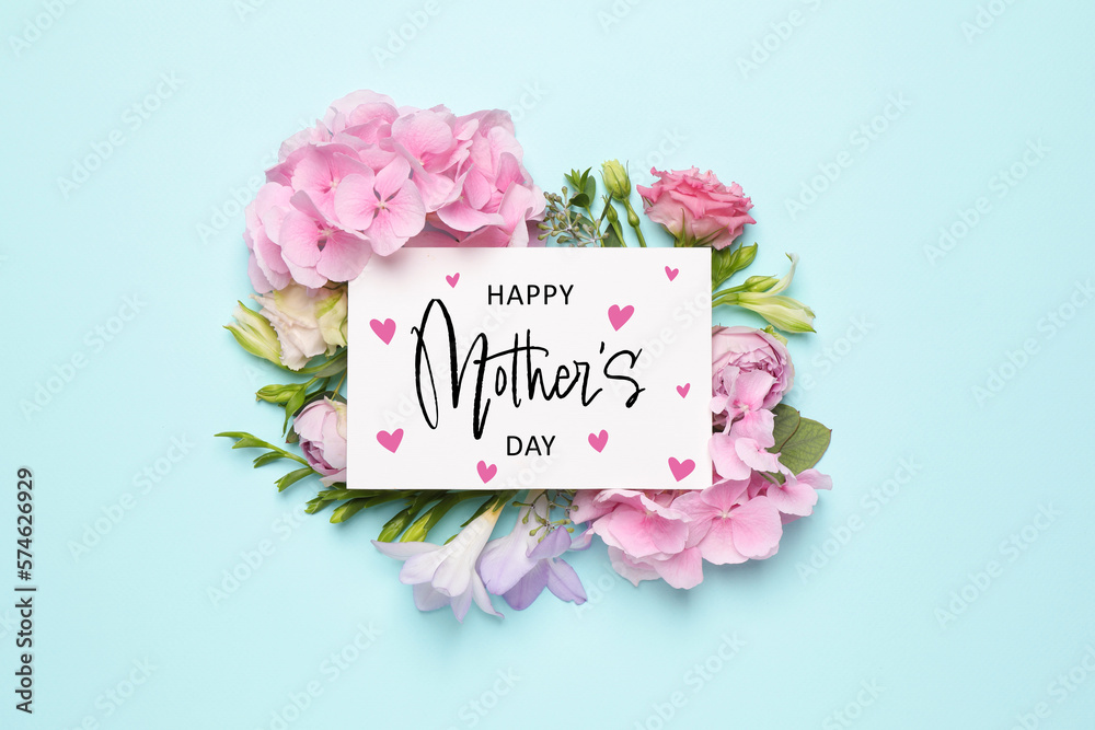 Happy Mother's Day greeting card and beautiful flowers on pale light blue background, flat lay - obrazy, fototapety, plakaty 