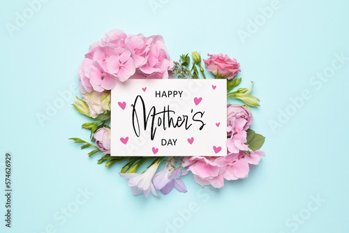 Fotografia Happy Mother's Day greeting card and beautiful flowers on pale light blue backgr