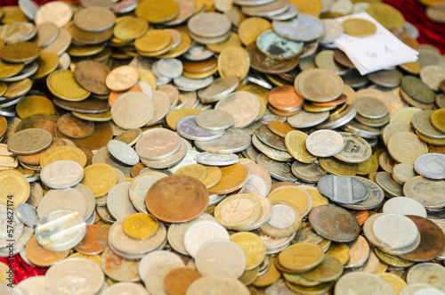 Old coins at the flea market, close-up, selective focus. photo