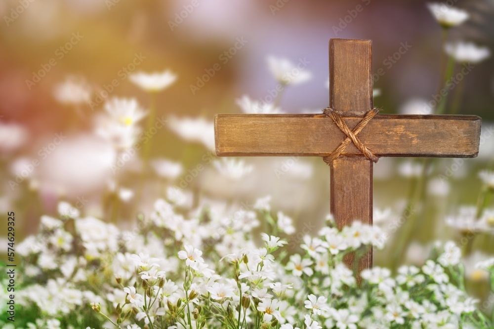 Wooden Cross in fresh spring flowers Wooden Cross in fresh spring flowers