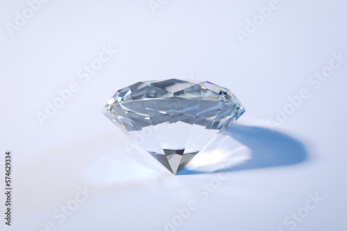Beautiful dazzling diamond on white background  closeup