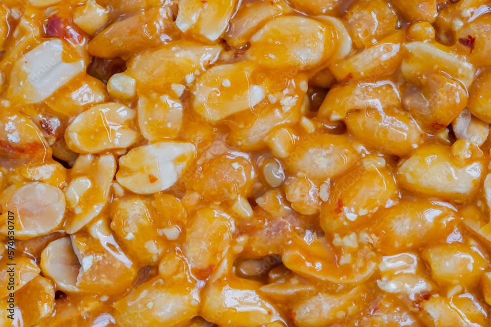 Top view: caramelized nuts fried in honey - Gozinaki - orange granola peanut bar - close up, macro. Traditional Georgian cuisine, oriental sweet, gastronomy and food concept Top view: caramelized nuts fried in honey - Gozinaki - orange granola peanut bar - close up, macro. Traditional Georgian cuisine, oriental sweet, gastronomy and food concept