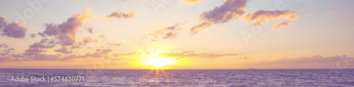 Beautiful panorama of sky with clouds over sea at sunset. Banner design