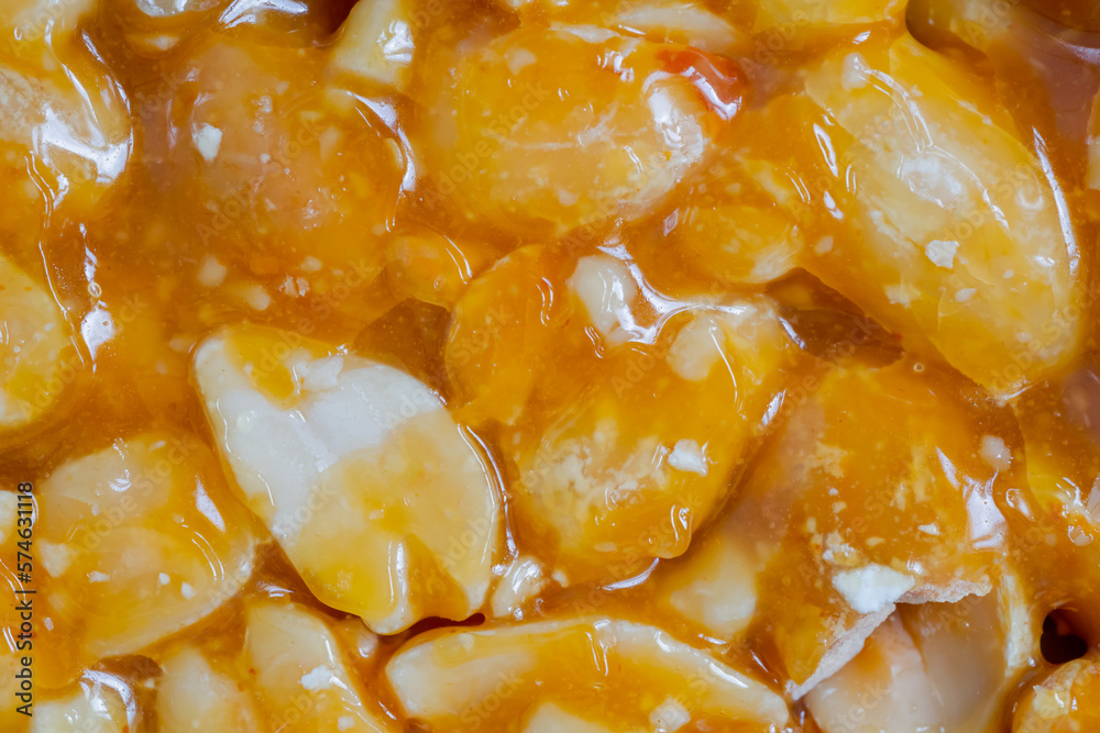Top view: caramelized nuts fried in honey - Gozinaki - orange granola peanut bar - macro, close up. Traditional Georgian cuisine, oriental sweet, gastronomy and food concept Top view: caramelized nuts fried in honey - Gozinaki - orange granola peanut bar - macro, close up. Traditional Georgian cuisine, oriental sweet, gastronomy and food concept