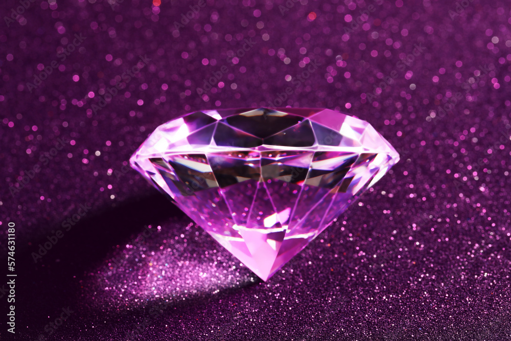 Beautiful diamond on shiny purple background, closeup Beautiful diamond on shiny purple background, closeup