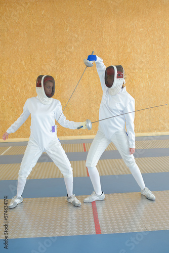 people and a fencing tournament