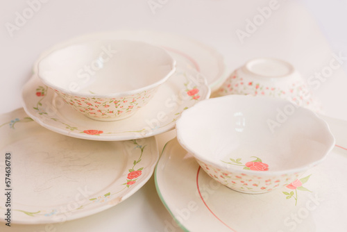 Closeup of porcelain plates and bowls