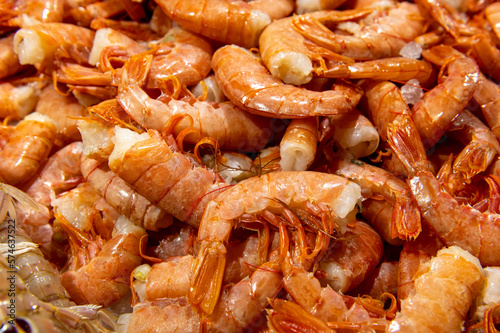 fresh orange shrimps on fish market