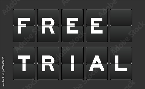 Black color analog flip board with word free trial on gray background