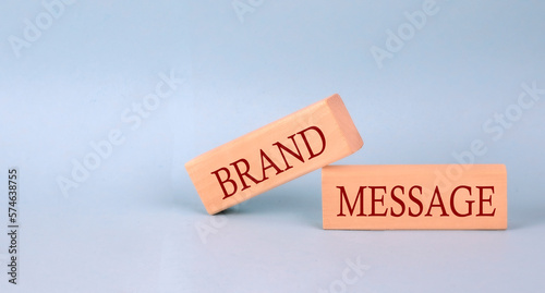 BRAND MESSAGE text on the wooden block, blue background