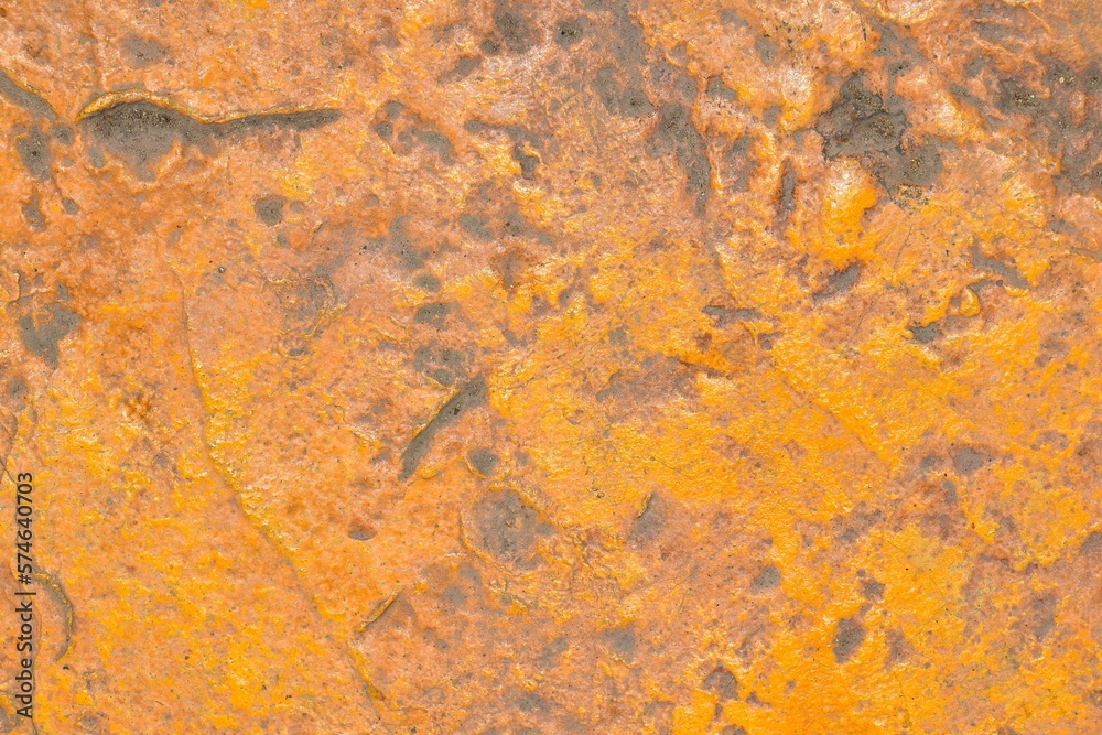 Grunge yellow old painted stone wall