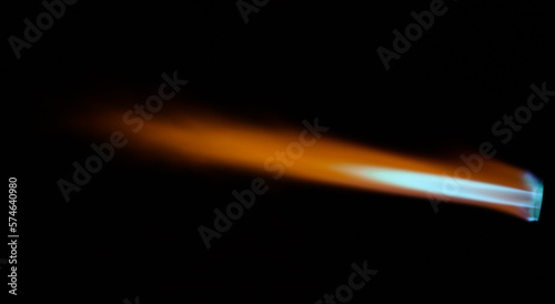 Flame of gas torch over black background photo