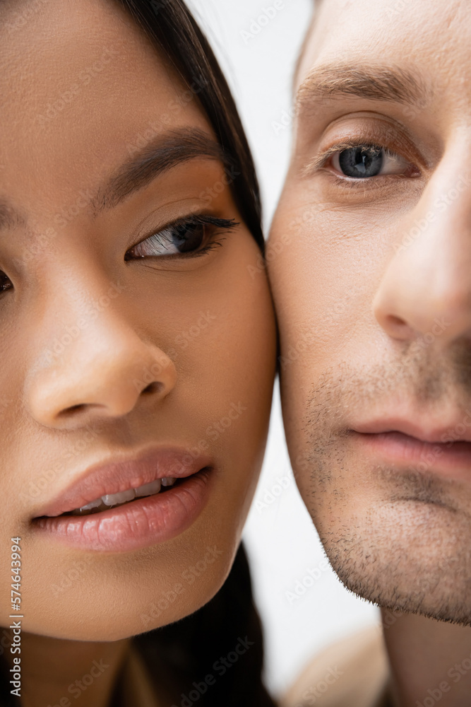 close up view of cropped interracial couple isolated on white. close up view of cropped interracial couple isolated on white.