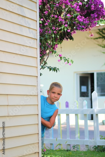 Baby is playing hide-and-seek in the village