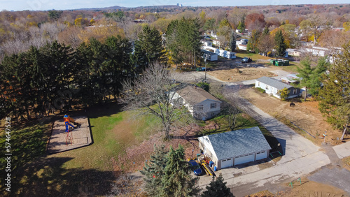 Aerial view mobile home park with Rochester downtown building in distance background, Upstate New York, USA photo