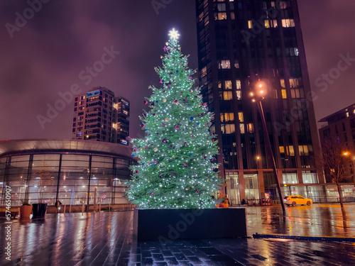 Christmas market scene outdoors with decorated tree in Canada Water area in London, UK