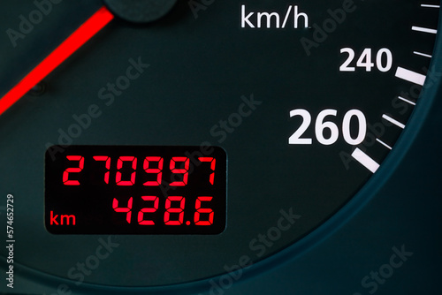 Digital mileage kilometrage indicator on oldschool car dashboard photo