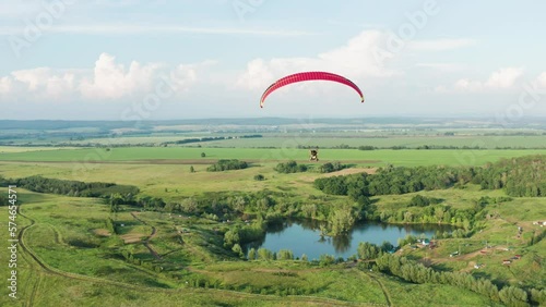 Southern Urals, a paramotor flies over Tugar-Salgan Lake. Aerial view.