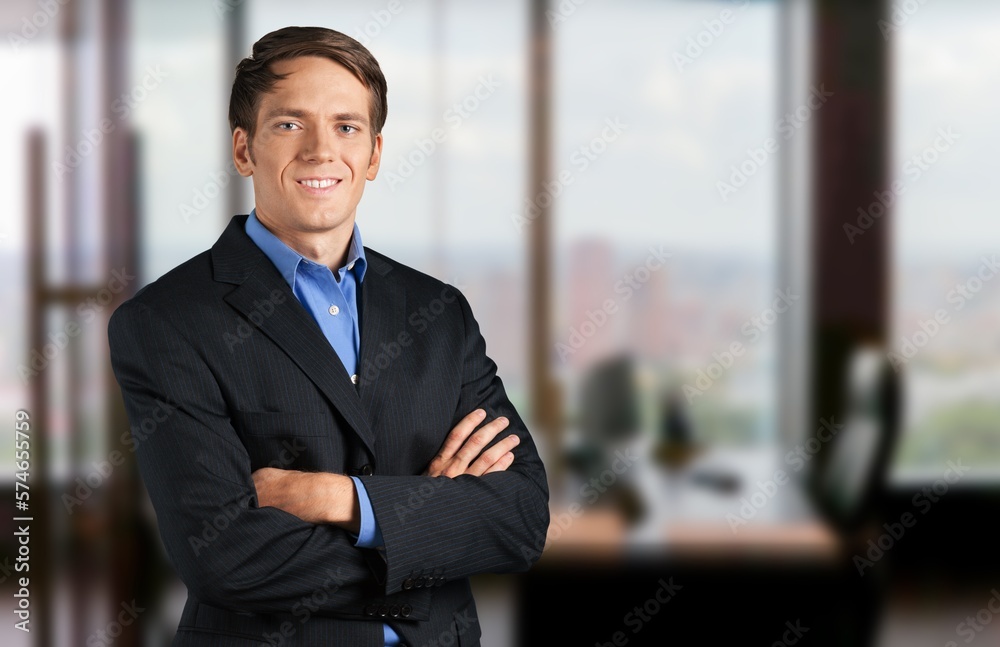Smiling young business man employer in office Smiling young business man employer in office