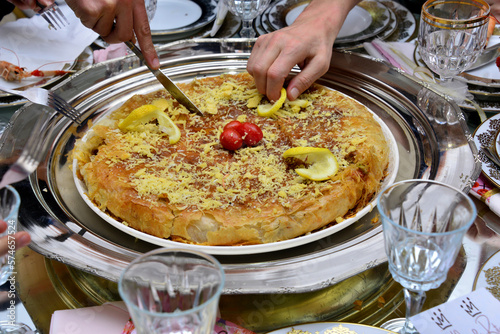 Moroccan pastilla or bastila with seafood, shrimp and calmari photo