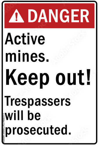 Active mining area danger sign and labels keep out, trespasser will be prosecuted