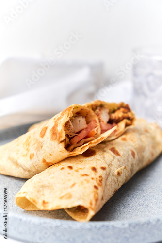 Two fresh chicken and salad tortilla wraps