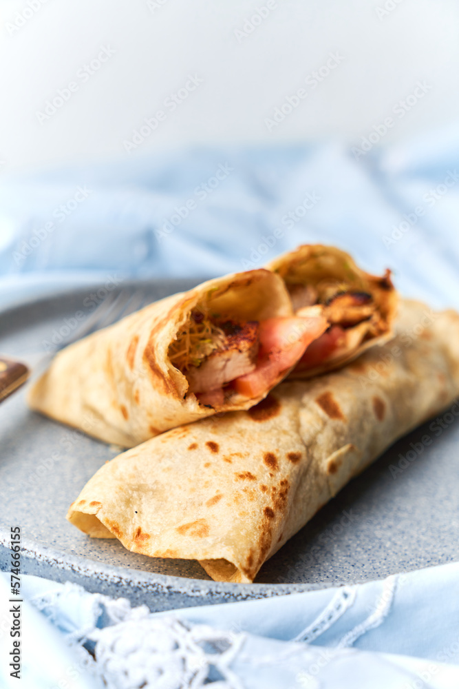 Fresh chicken roll with fresh tomatos, salad, wrap Fresh chicken roll with fresh tomatos, salad, wrap