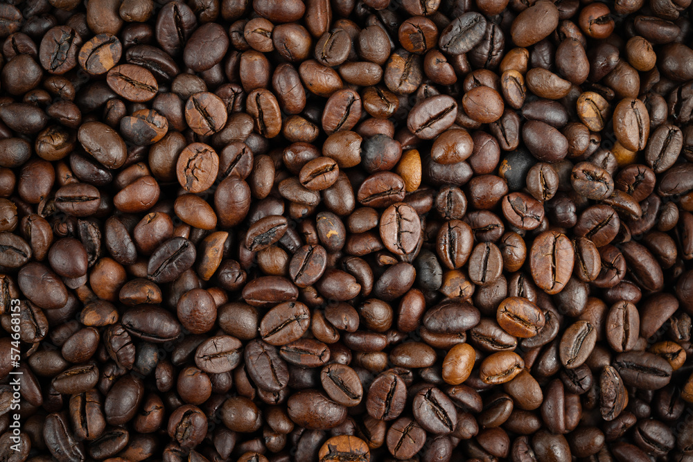 Roasted coffee beans background. Top view, close up Roasted coffee beans background. Top view, close up