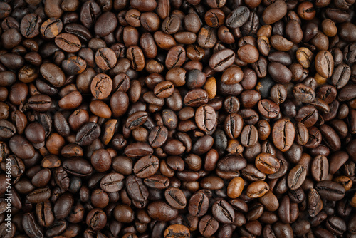 Roasted coffee beans background. Top view, close up