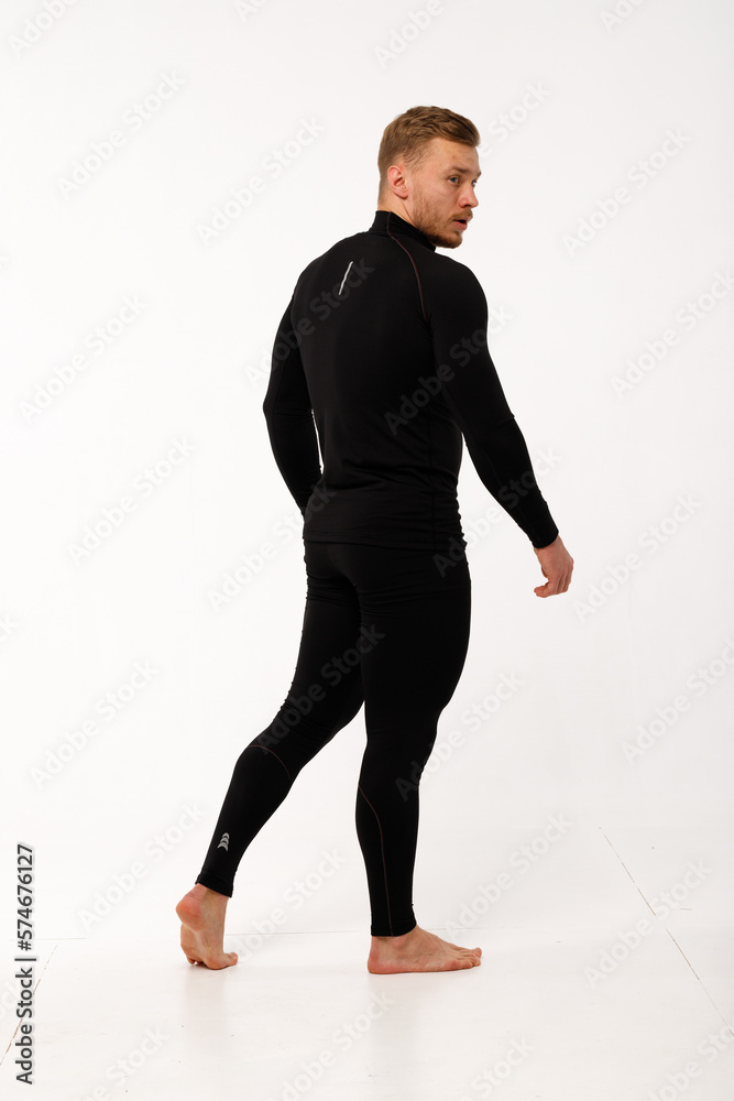A man with a sporty physique in thermal underwear.