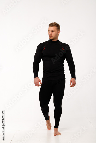 A man with a sporty physique in thermal underwear.