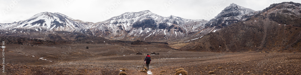 hiker walking alone in tongarino national park new zealand hiker walking alone in tongarino national park new zealand