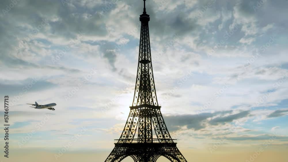 An unbranded commercial airplane flying past the silhouette of the Eiffel Tower at dawn.