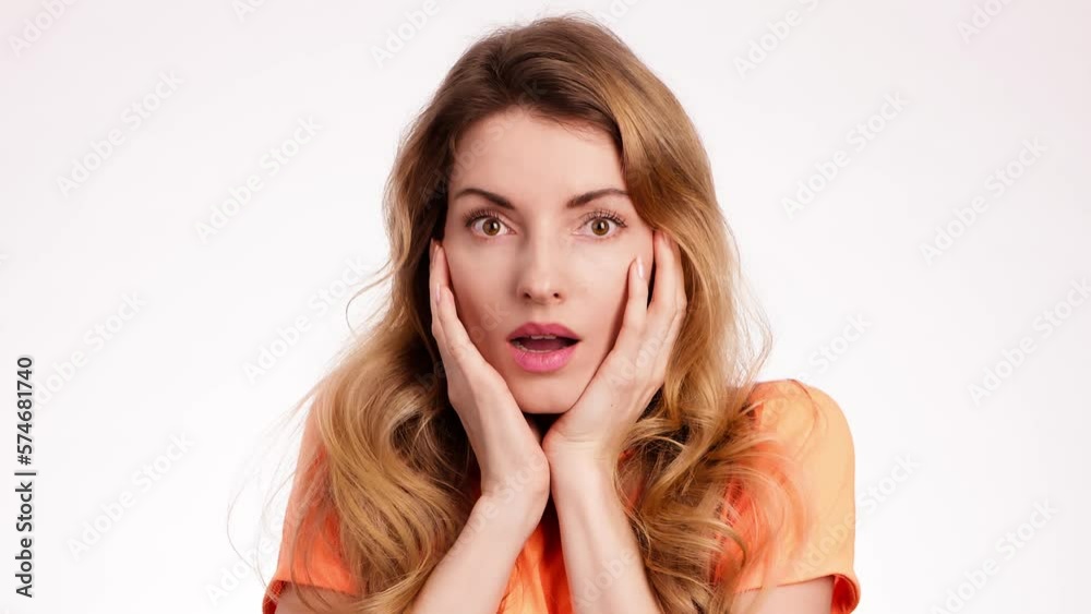 Wow. Surprised emotional young woman hands up with big eyes, open mouth, shocked. Blonde lady amazed excited by victory win. Oh my god expression. Indoor studio isolated on white background Wow. Surprised emotional young woman hands up with big eyes, open mouth, shocked. Blonde lady amazed excited by victory win. Oh my god expression. Indoor studio isolated on white background