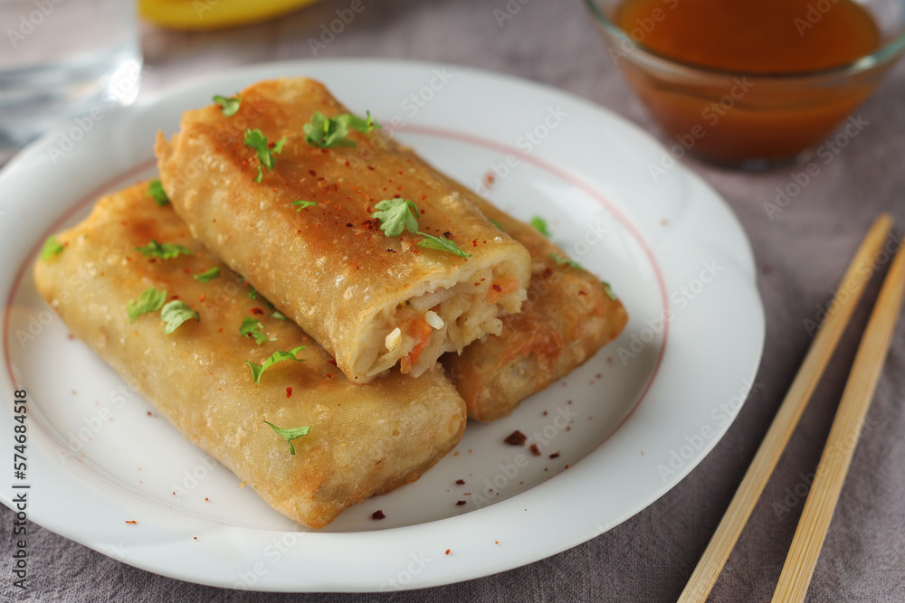 Spring rolls - a typical dish in Chinese and other Southeast Asian cuisines Spring rolls - a typical dish in Chinese and other Southeast Asian cuisines