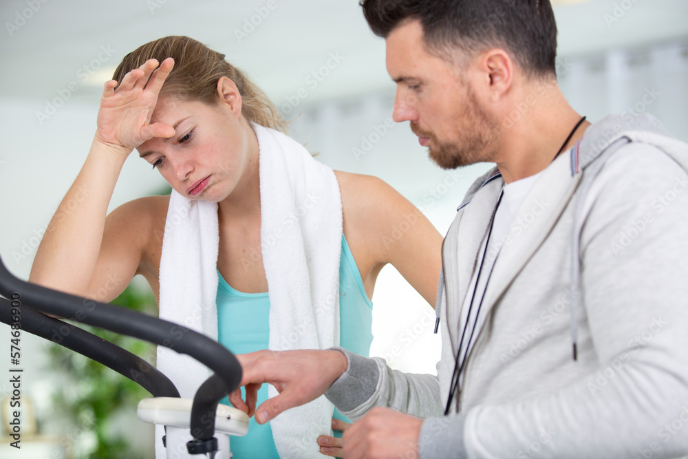 man coach is training a woman at home
