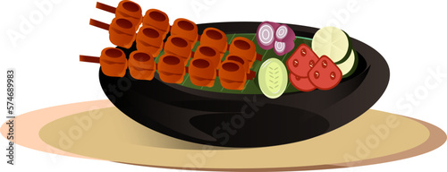 a satay dish served on a black bowl with peanut sauce
