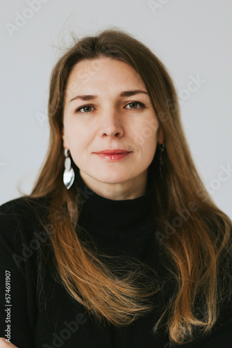 beautiful middle aged real woman portrait on white background, emotions of joy and smile, professional and selfmade businesswoman