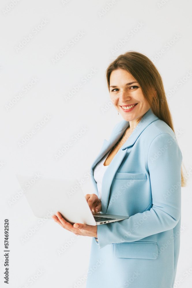 beautiful middle aged real woman portrait with laptop on white background, professional and selfmade businesswoman working online beautiful middle aged real woman portrait with laptop on white background, professional and selfmade businesswoman working online