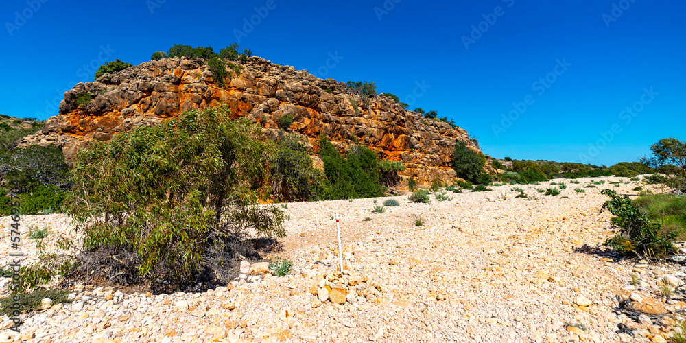 panorama of mandu mandu gorge in cape range national park, western australia; scenic gorge with white stones and red rocks near exmouth