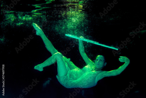 Model underwater with flute floating